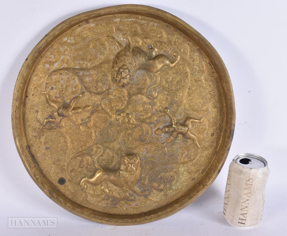 AN INDIAN EMBOSSED BRONZE HINDU DEITY AND LION DISH. 35.5 cm wide. (1 of 5)