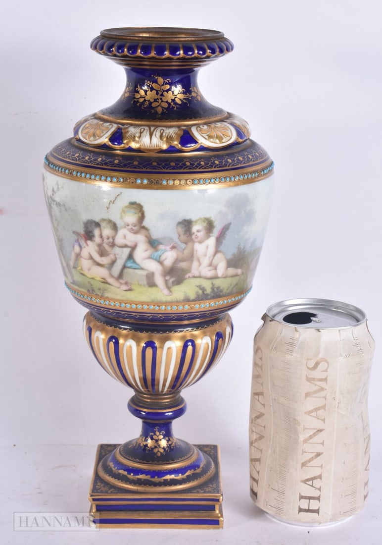 A 19TH CENTURY FRENCH SEVRES PORCELAIN VASE painted with putti within a landscape. 26.5 cm high. (1 of 7)