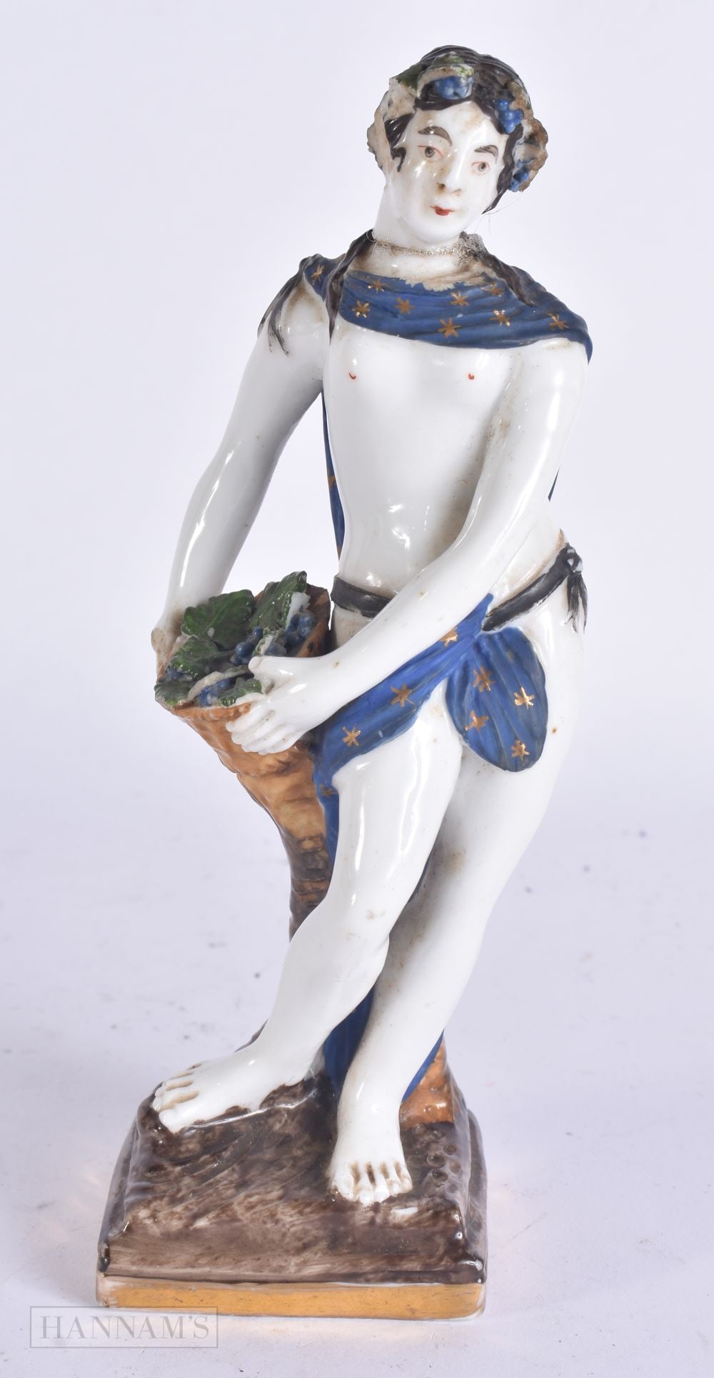 A RARE EARLY 19TH CENTURY RUSSIAN PORCELAIN FIGURE modelled as a female holding a basket. 18 cm high: A RARE EARLY 19TH CENTURY RUSSIAN PORCELAIN FIGURE modelled as a female holding a basket. 18 cm high.