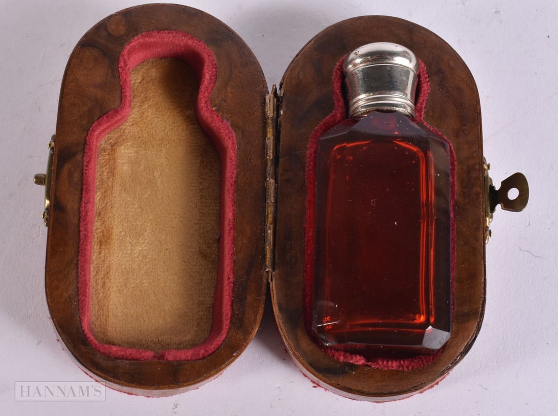 A CHARMING VICTORIAN RUBY GLASS SCENT BOTTLE within a walnut fitted case. 10 cm x 5.5 cm. (1 of 5)