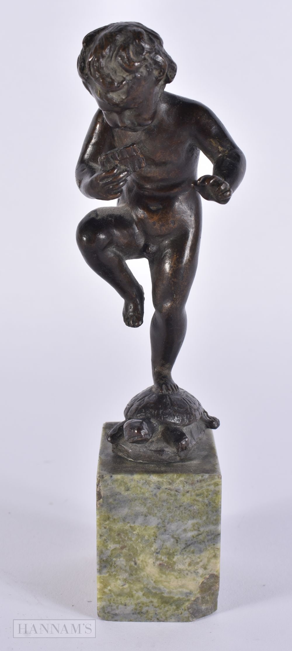 A 19TH CENTURY GRAND TOUR BRONZE FIGURE OF A PIPE PLAYER modelled standing upon a tortoise. 18 cm hi (1 of 6)