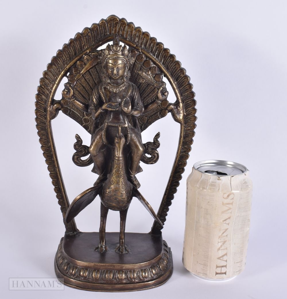 A LARGE 19TH CENTURY INDIAN BRONZE FIGURE OF A DEITY modelled riding upon a bird. 27 cm x 14 cm.: A LARGE 19TH CENTURY INDIAN BRONZE FIGURE OF A DEITY modelled riding upon a bird. 27 cm x 14 cm.