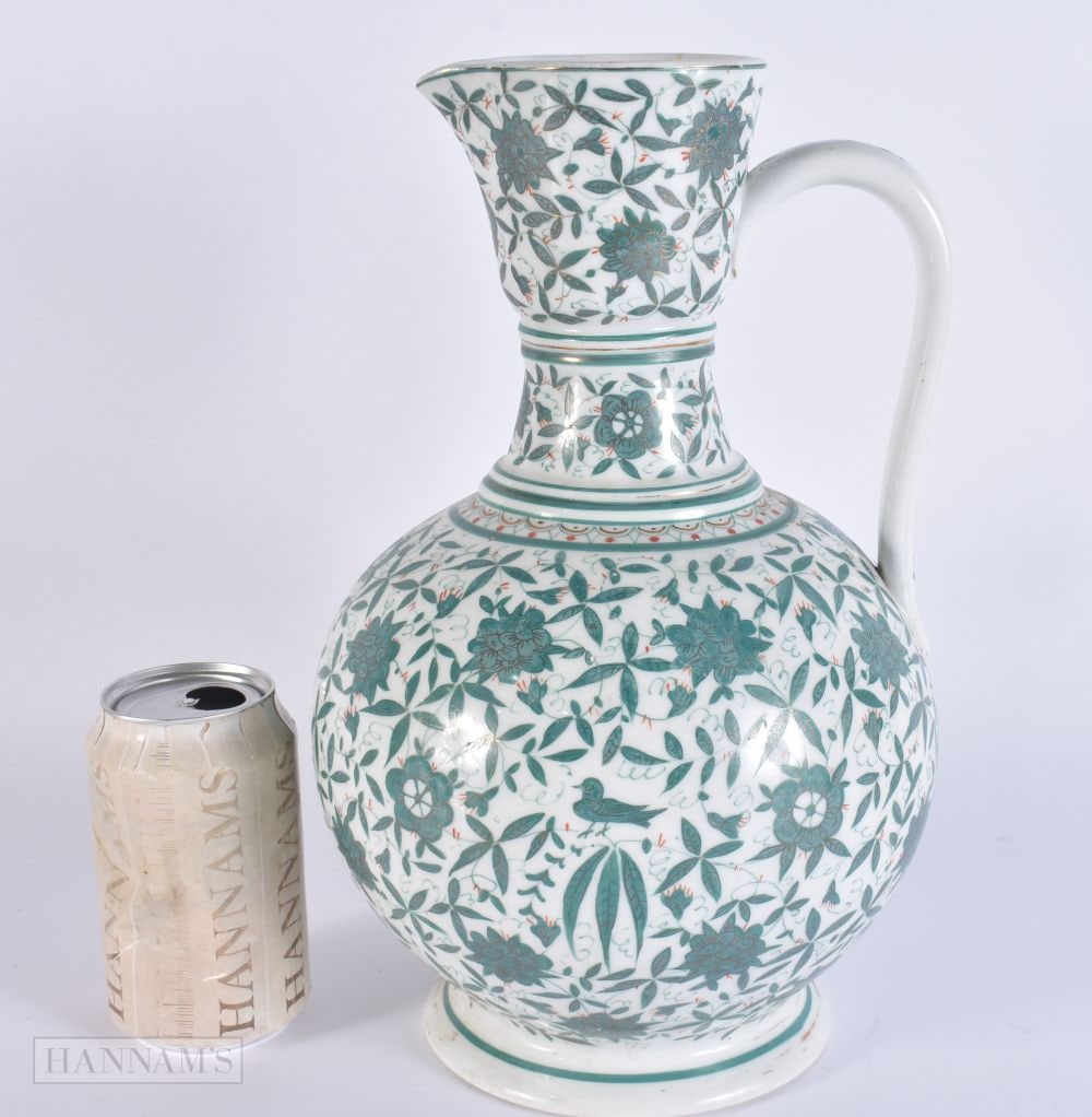 A LARGE ANTIQUE FRENCH IZNIK PORCELAIN JUG painted with flowers. 32 cm x 14 cm. (1 of 6)