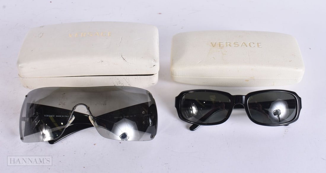 Versace Designer Sunglasses Cased. (2) WE ARE UNABLE TO OFFER IN-HOUSE SHIPPING ON THIS LOT TO USA: Versace Designer Sunglasses Cased. (2) WE ARE UNABLE TO OFFER IN-HOUSE SHIPPING ON THIS LOT TO USA AND CANADA