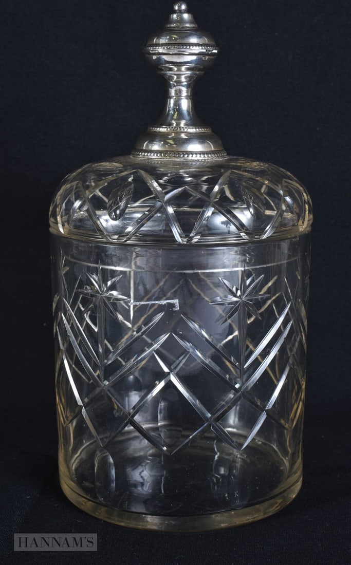 A SILVER MOUNTED CRYSTAL GLASS JAR AND COVER. 23 cm x 12 cm.: A SILVER MOUNTED CRYSTAL GLASS JAR AND COVER. 23 cm x 12 cm.