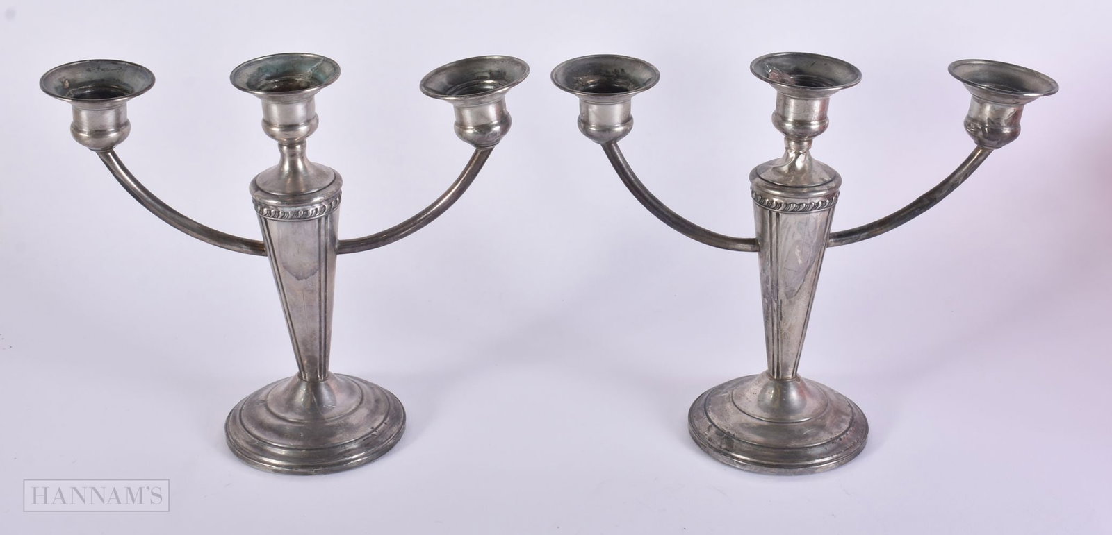 A PAIR OF SILVER CANDLESTICKS. 590 grams overall. 18 cm x 14 cm. (1 of 4)