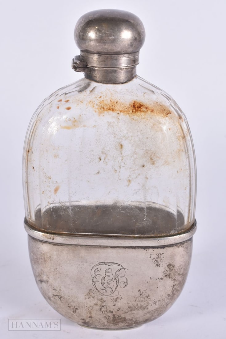 AN ANTIQUE SILVER MOUNTED GLASS HIP FLASK. Weighable silver 68 grams. 15 cm x 8 cm. (1 of 4)