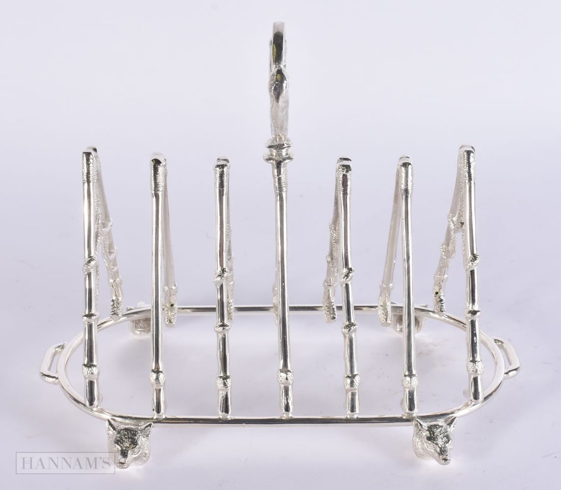 A SILVER PLATED HUNTING TOAST RACK. 18 cm x 15 cm. (1 of 3)