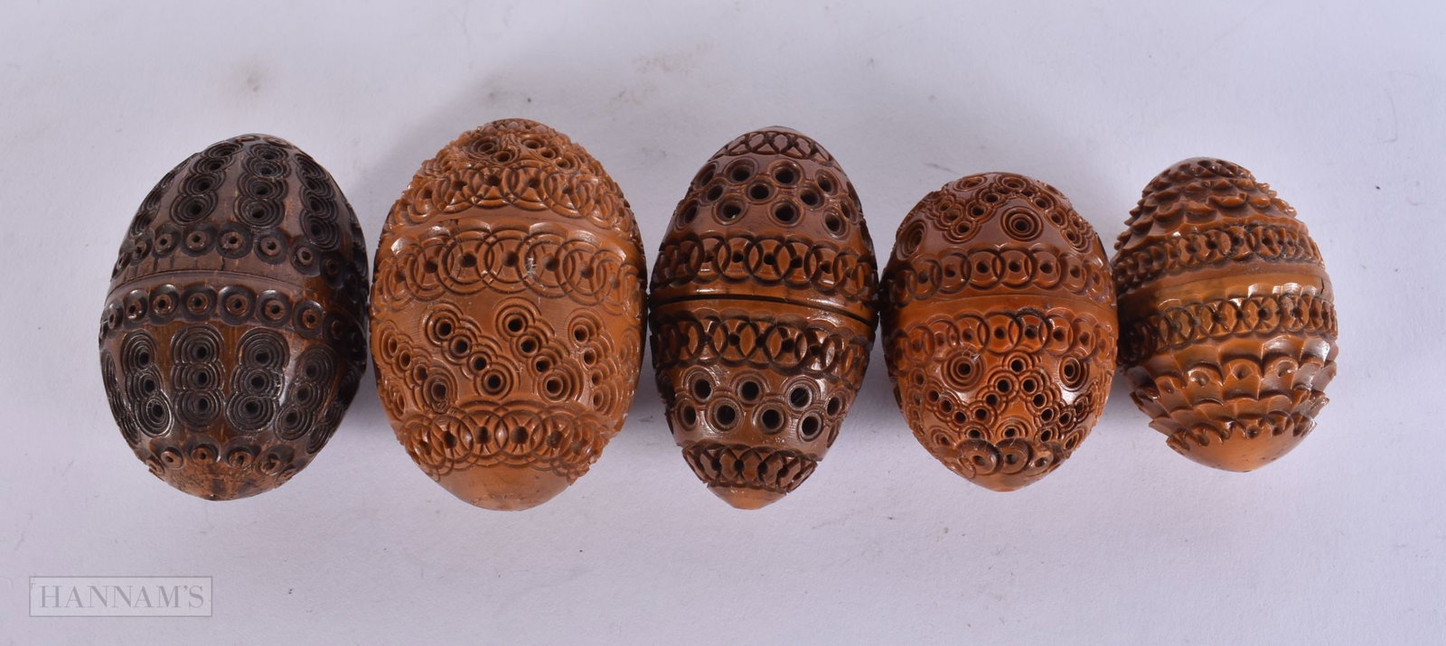 FIVE CARVED RETICULATED COQUILLA NUTS. 6.5 cm x 4 cm. (5) (1 of 3)