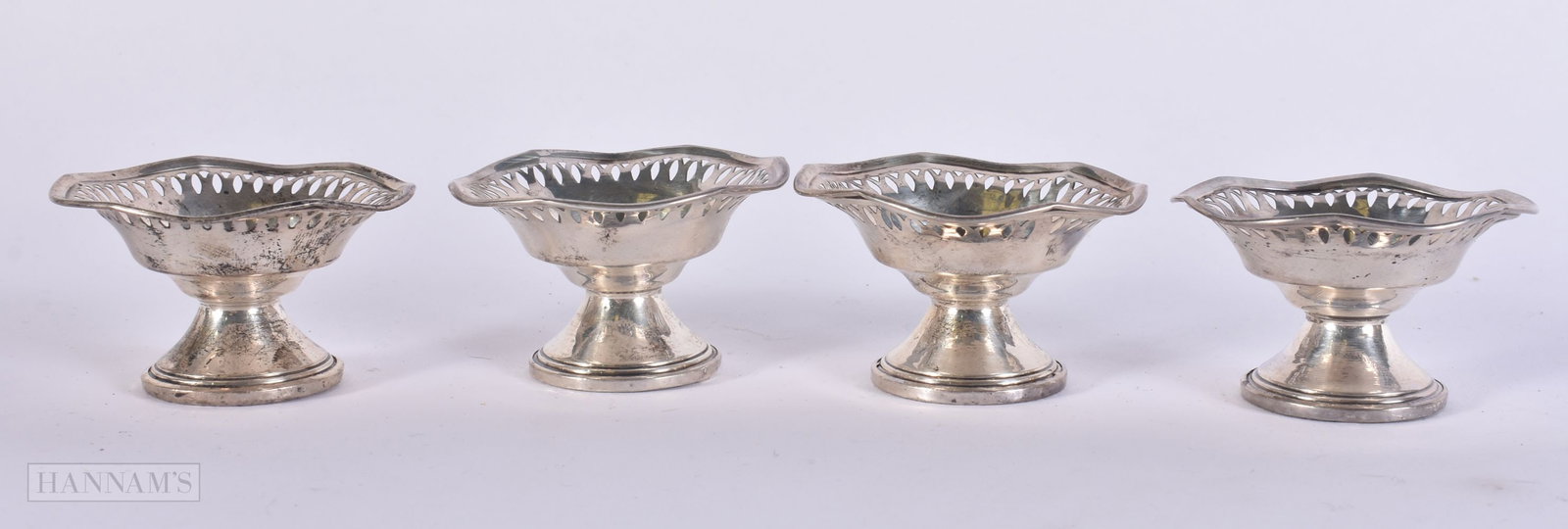 FOUR SILVER SALTS. 90 grams overall. 5.5 cm wide. (4) (1 of 4)