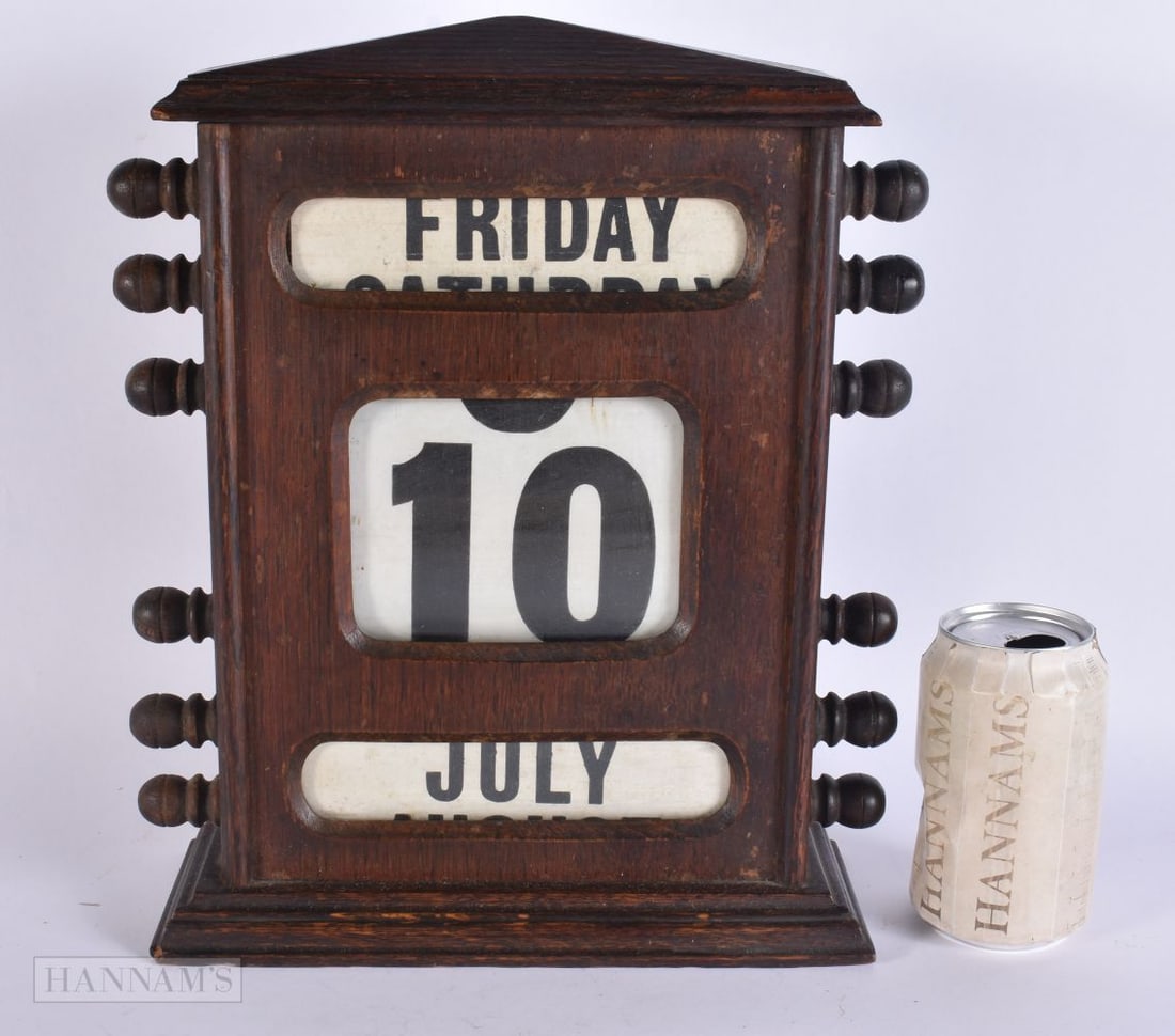 AN ANTIQUE OAK DESK CALENDAR. 30 cm x 22 cm. (1 of 4)