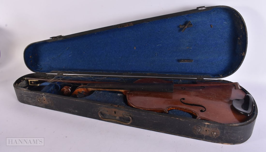 A CASED VIOLIN. 58.5 cm long, length of back inc hump 35.5 cm long. (1 of 4)