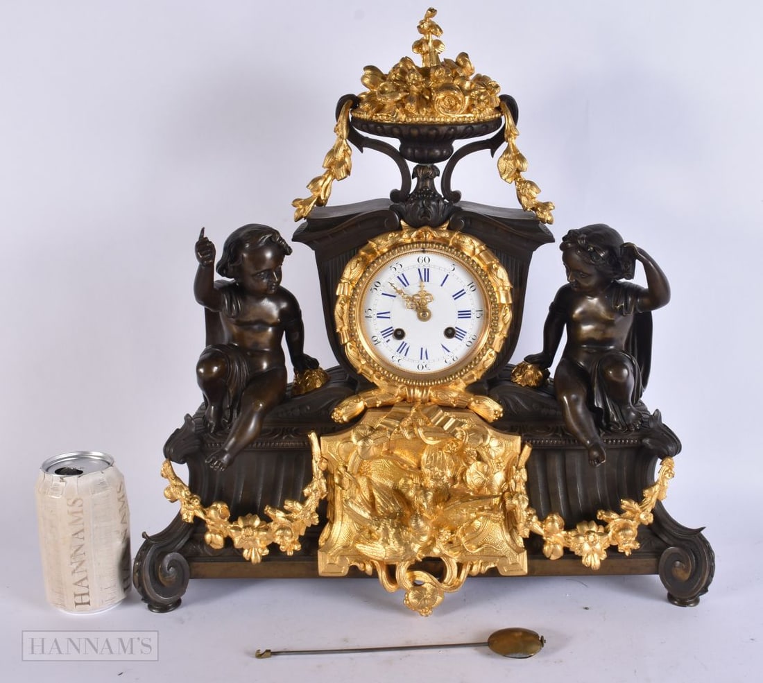 A LARGE 19TH CENTURY FRENCH BRONZE AND GILT BRONZE PUTTI MANTEL CLOCK. 44 cm x 34 cm. (1 of 8)