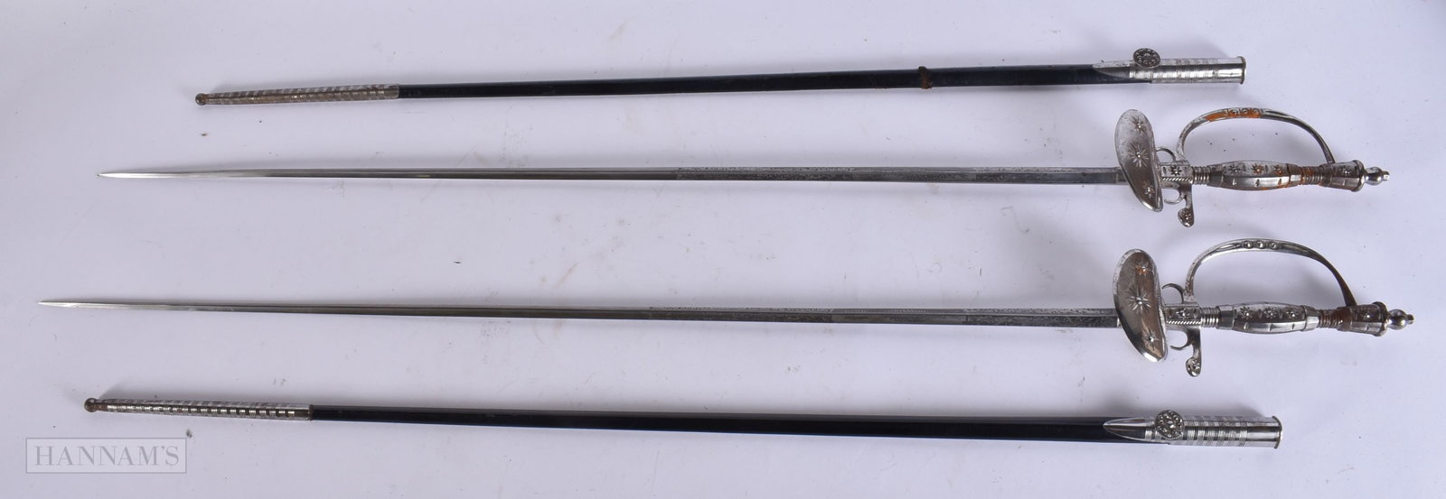 TWO STEEL CUT SWORDS. 96 cm. (2) WE ARE UNABLE TO OFFER IN-HOUSE SHIPPING ON THIS LOT: TWO STEEL CUT SWORDS. 96 cm. (2) WE ARE UNABLE TO OFFER IN-HOUSE SHIPPING ON THIS LOT