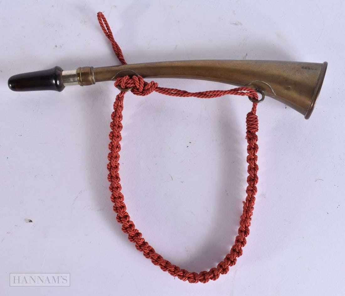 AN ANTIQUE BRASS HORN stamped SE & CR. 27 cm long. (1 of 4)