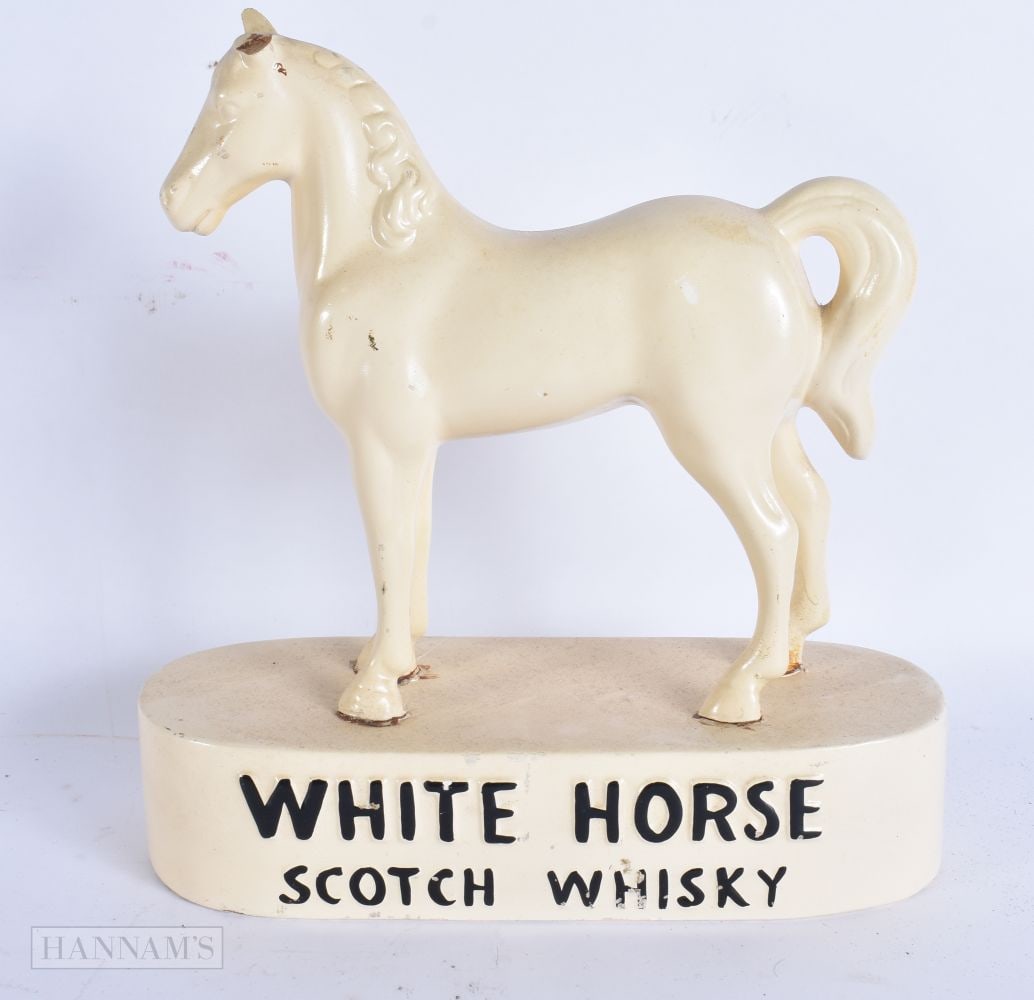 A VINTAGE CERAMIC WHITE HORSE SCOTCH WHISKEY ADVERTISING HORSE. 23 cm x 17 cm.: A VINTAGE CERAMIC WHITE HORSE SCOTCH WHISKEY ADVERTISING HORSE. 23 cm x 17 cm.