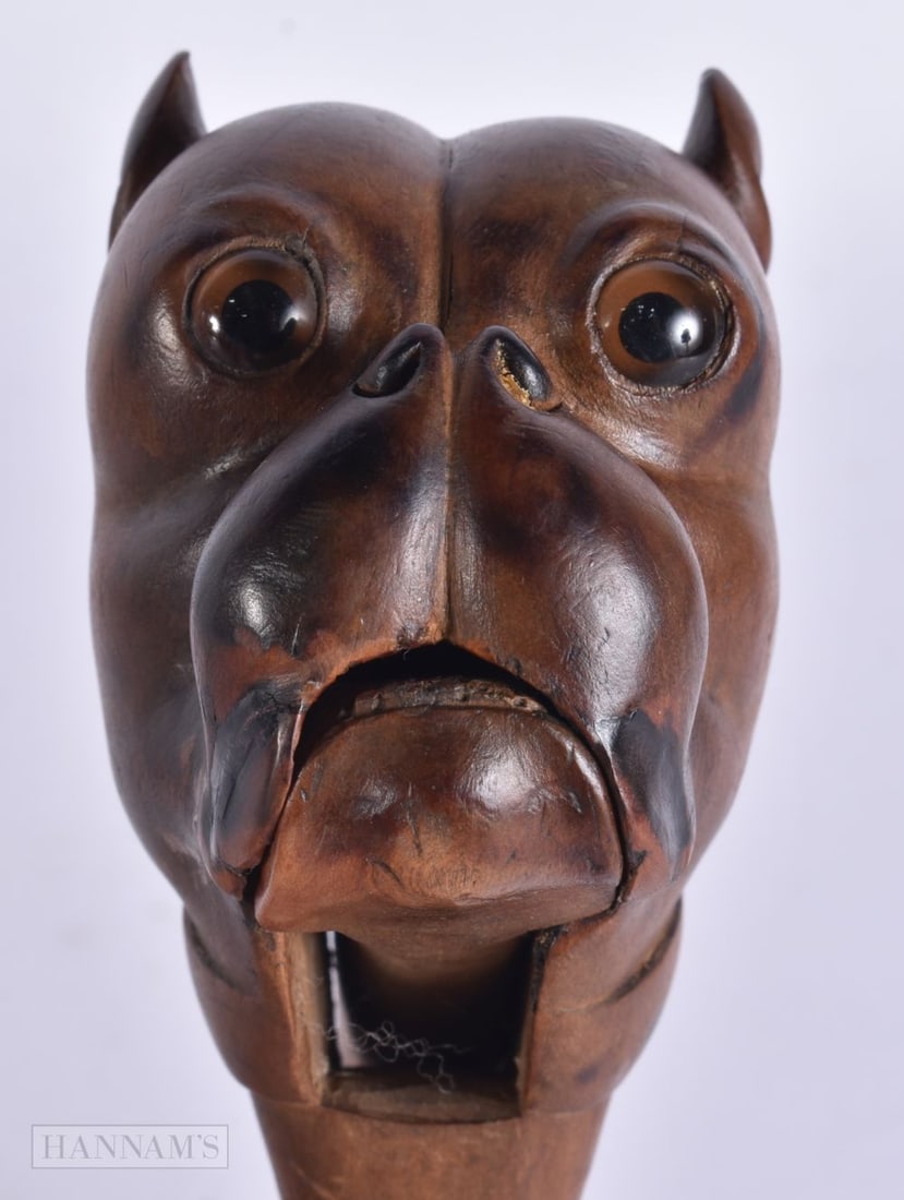 A LARGE PAIR OF 19TH CENTURY BAVARIAN BLACK FOREST HOUND NUT CRACKERS. 20 cm x 6.5 cm. (1 of 4)