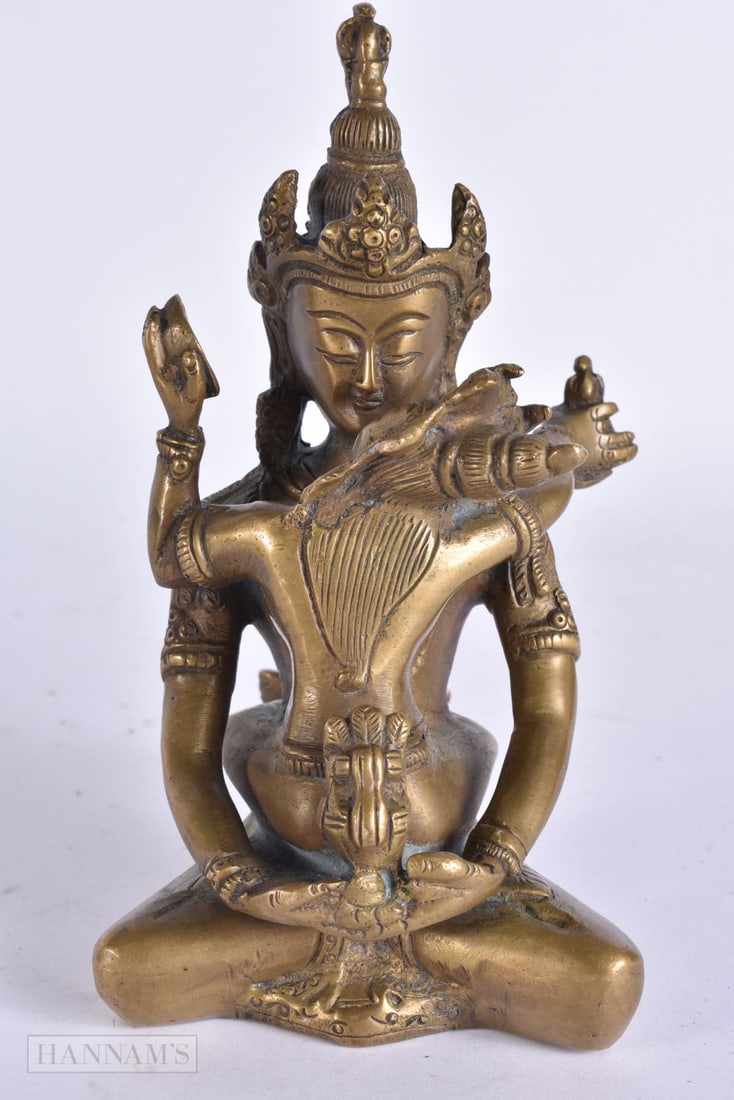 A 19TH CENTURY INDIAN TIBETAN BRONZE EROTIC DEITY modelled as a male with consort. 15.5 cm high. (1 of 6)