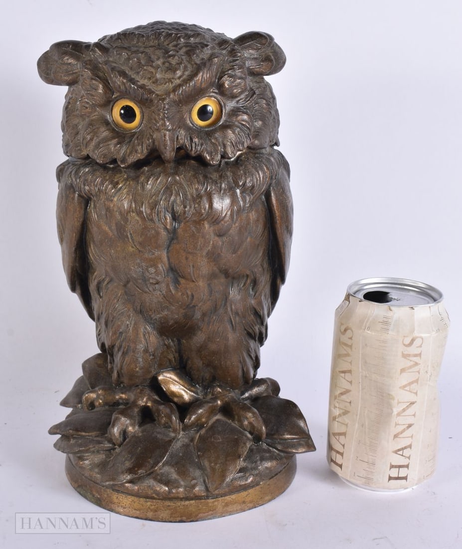 A CHARMING VICTORIAN SPELTER OWL TOBACCO JAR AND COVER. 27 cm x 10 cm.: A CHARMING VICTORIAN SPELTER OWL TOBACCO JAR AND COVER. 27 cm x 10 cm.