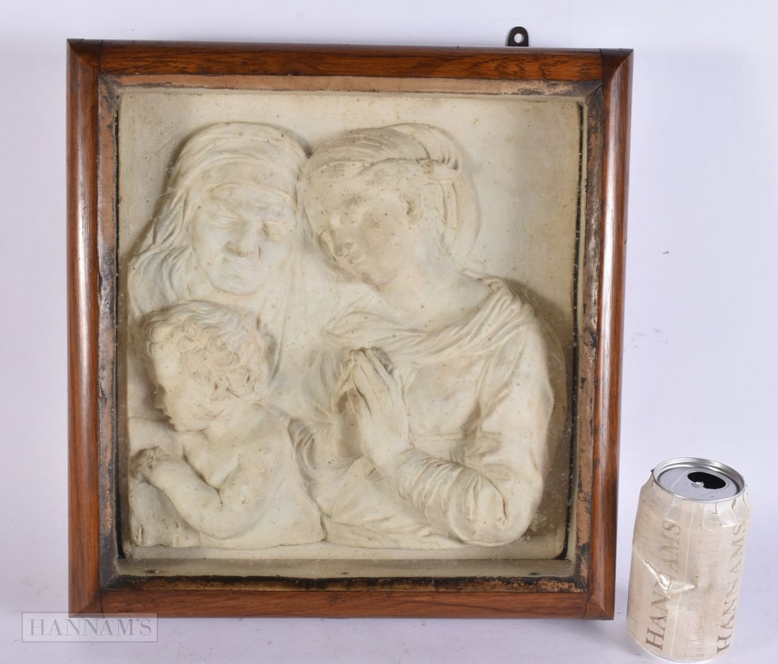 A 19TH CENTURY FRAMED RELIGIOUS STUCCO TYPE PANEL depicting saints and a child. 38 cm x 32 cm.: A 19TH CENTURY FRAMED RELIGIOUS STUCCO TYPE PANEL depicting saints and a child. 38 cm x 32 cm.