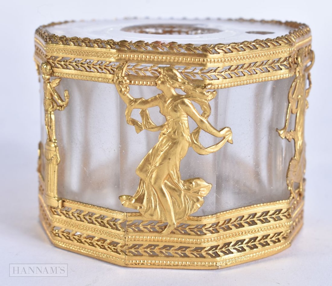 A LATE 19TH CENTURY FRENCH GILT METAL GLASS INKWELL decorated with classical figures. 6 cm wide. (1 of 5)