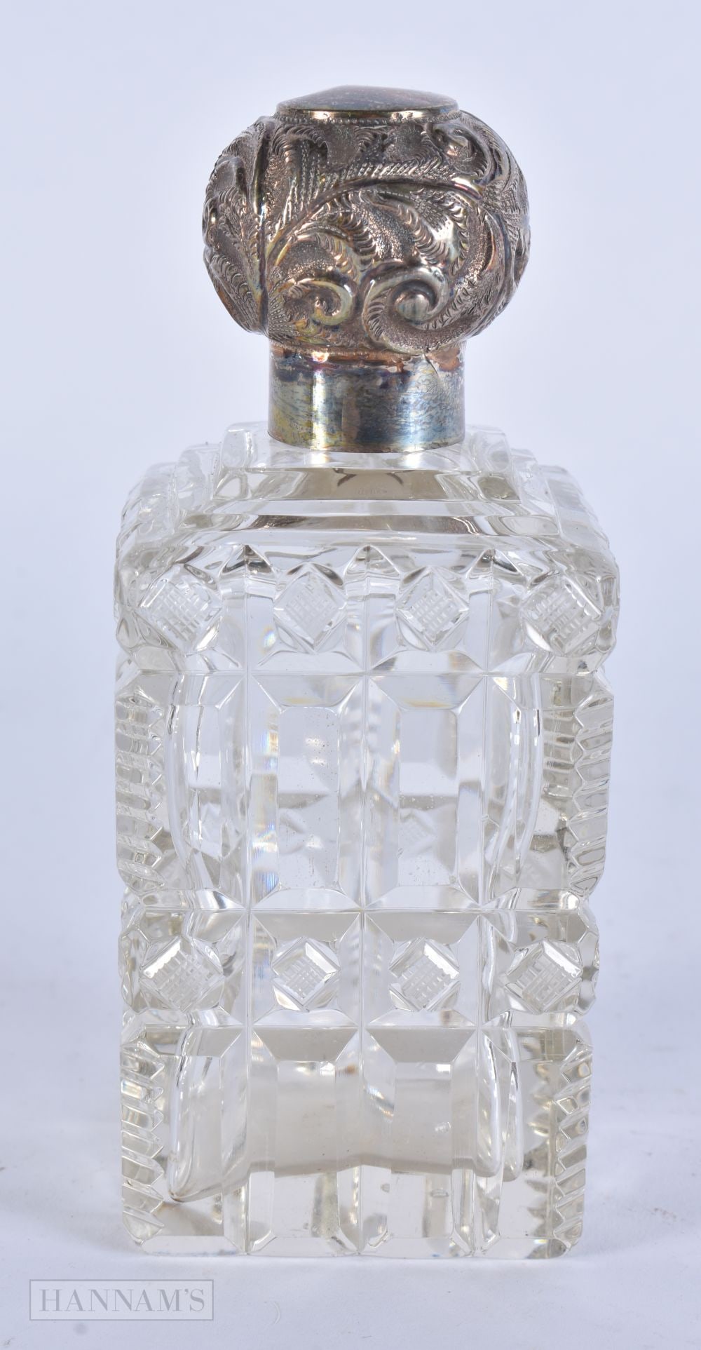 AN ANTIQUE SILVER MOUNTED CUT GLASS SCENT BOTTLE. 12.5 cm high. (1 of 4)