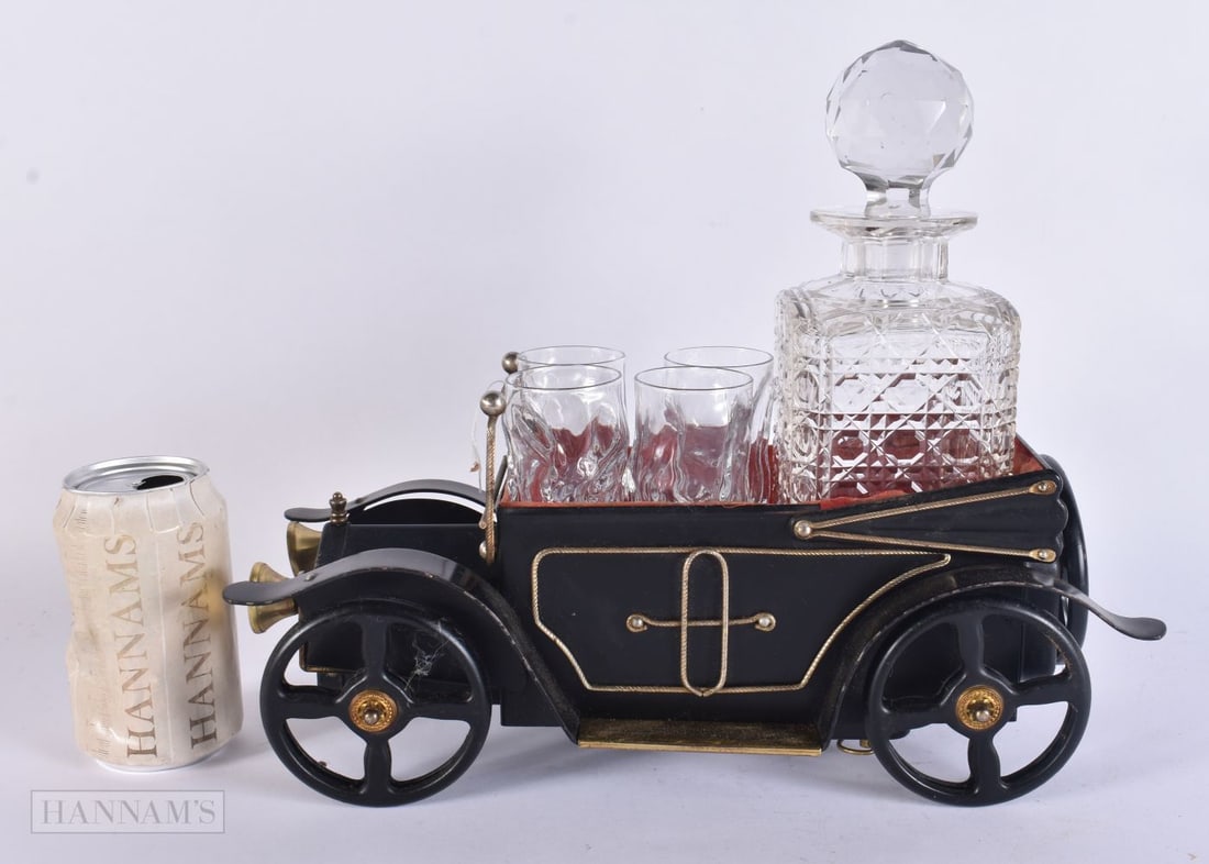 AN UNUSUAL AUTOMOTIVE INTEREST MUSICAL DECANTER TANTALUS. 32 cm wide. (1 of 5)