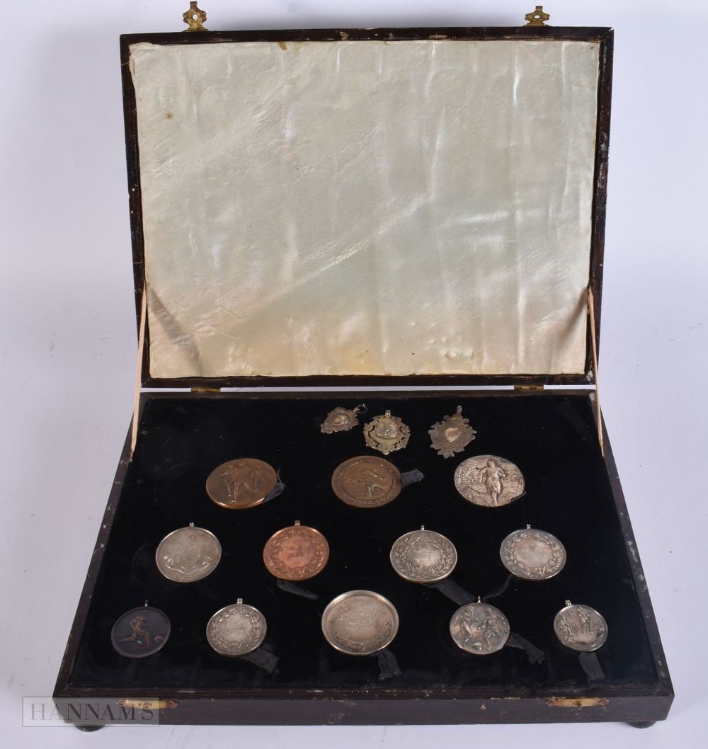 A LOVELY COLLECTION OF 1930S FOOTBALL & ATHLETIC MEDALS mainly silver. Box 30 cm x 22 cm. (1 of 6)