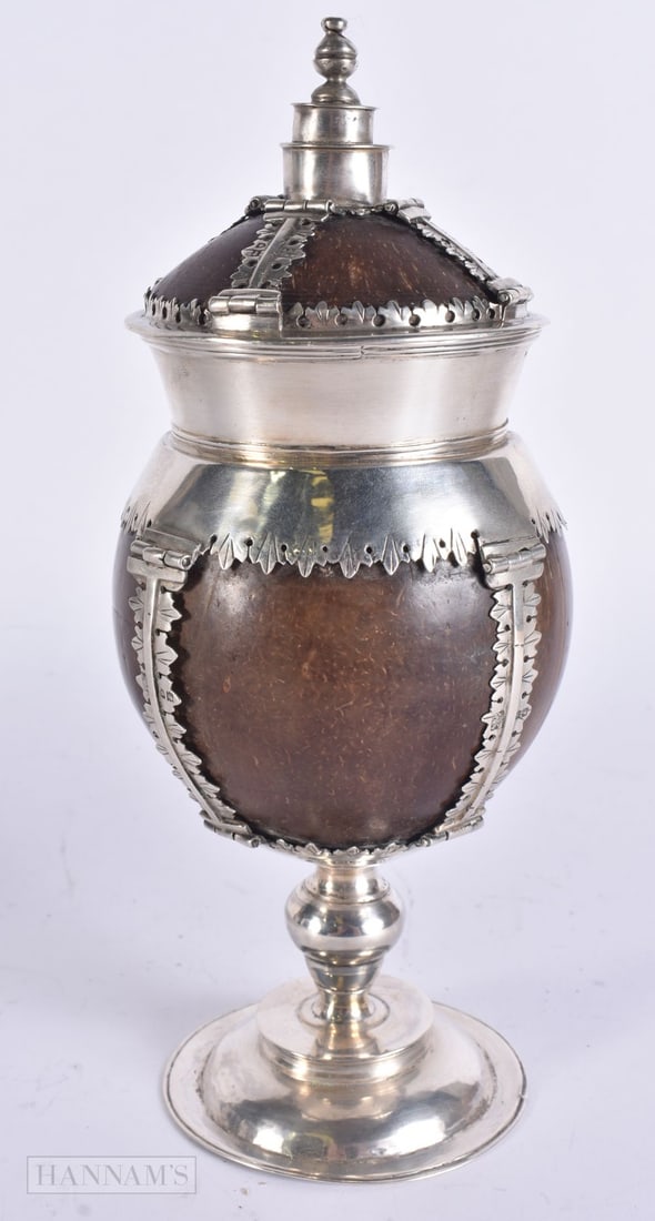 AN ANTIQUE SILVER MOUNTED COCONUT CUP AND COVER by Alfred James, Francis William & Arthur Walter Pai: AN ANTIQUE SILVER MOUNTED COCONUT CUP AND COVER by Alfred James, Francis William & Arthur Walter Pairpoint. 23 cm high.