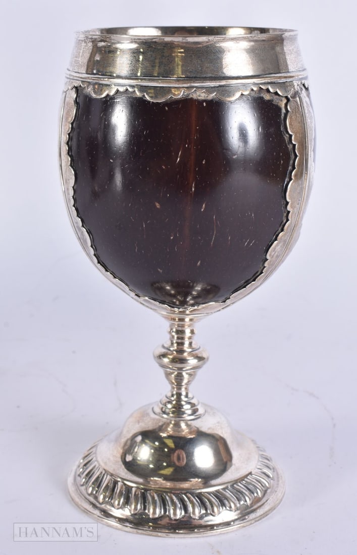 A MID 18TH CENTURY SILVER MOUNTED STRAP WORK COCONUT CUP. 17 cm high. (1 of 7)