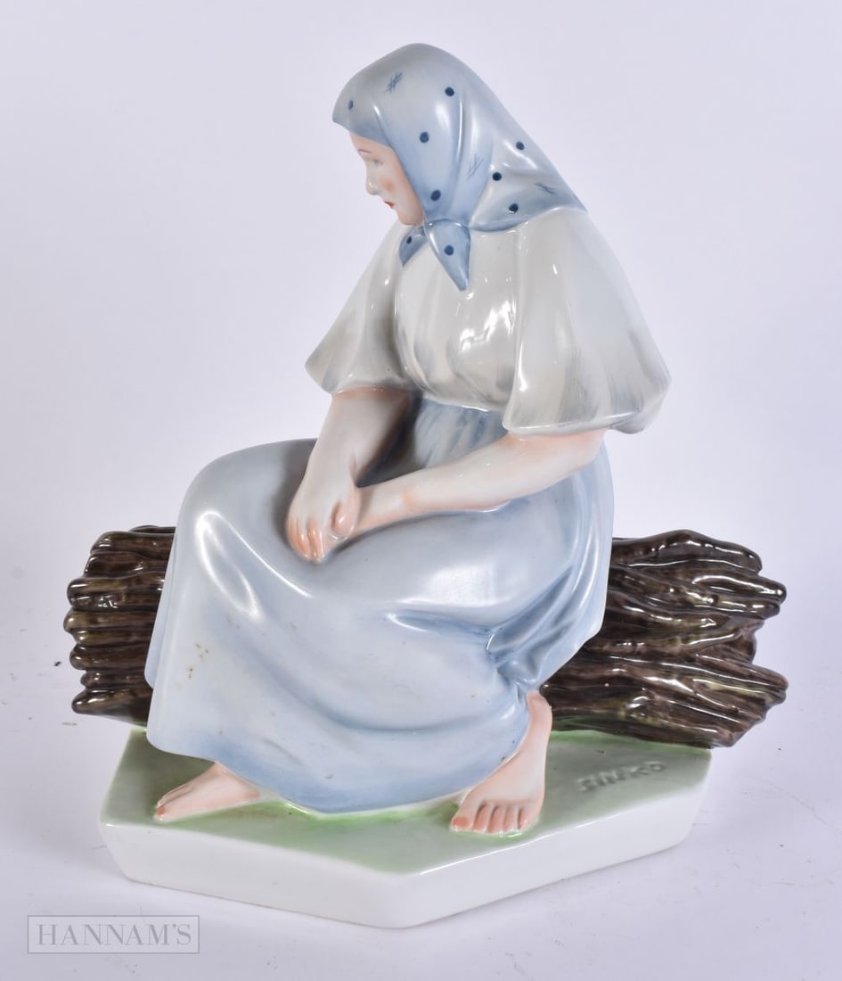 AN UNUSUAL LARGE ZSOLNAY PECS CERAMIC FIGURE OF A FEMALE by Andras Sinko. 27.5 cm x 22cm. (1 of 8)