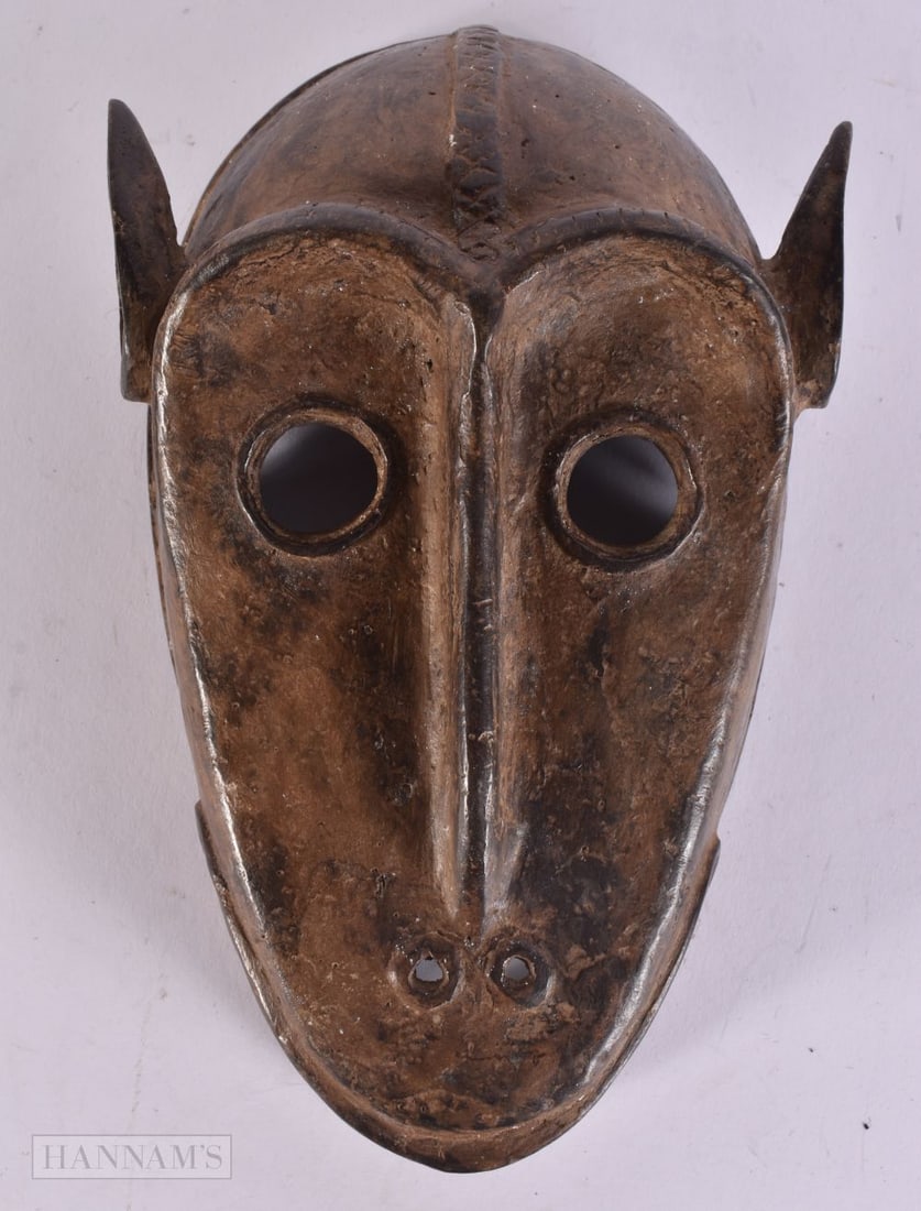 AN AFRICAN BENIN BRONZE MASK. 24 cm long. (1 of 4)