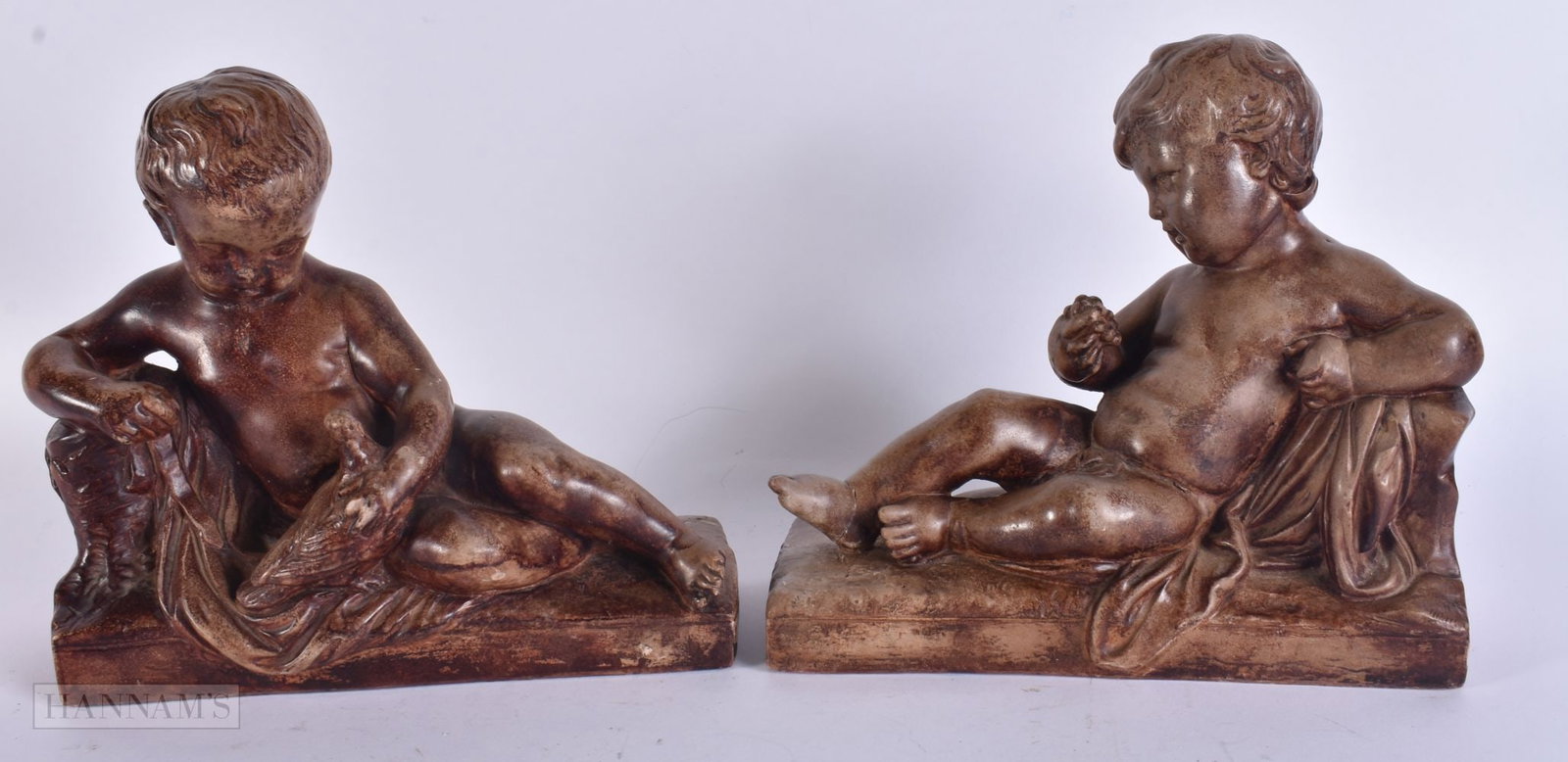 A PAIR OF ANTIQUE POTTERY FIGURES. 22 cm x 22 cm.: A PAIR OF ANTIQUE POTTERY FIGURES. 22 cm x 22 cm.