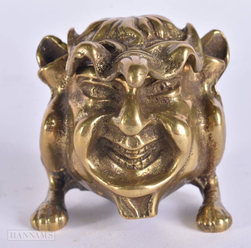 A VICTORIAN GOTHIC BRONZE INKWELL formed as a scowling fantastical beast. 8 cm x 6 cm.: A VICTORIAN GOTHIC BRONZE INKWELL formed as a scowling fantastical beast. 8 cm x 6 cm.