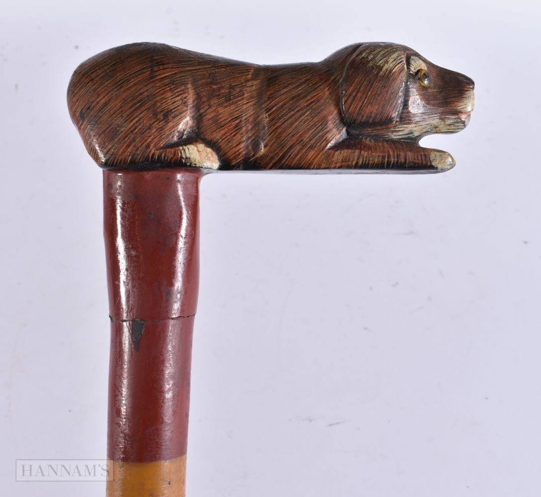 A FOLK ART PAINTED WOOD RECUMBENT HOUND WALKING CANE. 88 cm x 15 cm. (1 of 7)