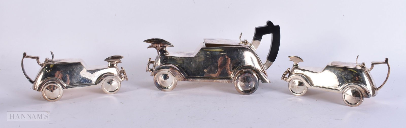 A SILVER PLATED CAR TEASET. Largest 27 cm wide. (3) (1 of 5)