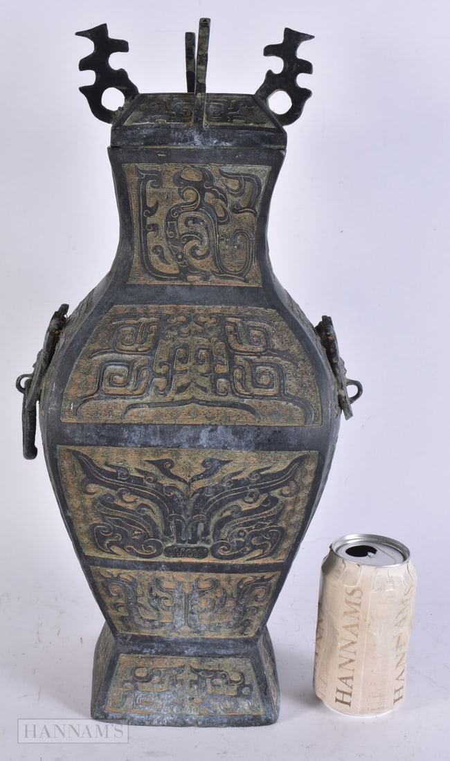 A CHINESE BRONZE ARCHAIC VASE AND COVER. 45 cm x 15 cm.: A CHINESE BRONZE ARCHAIC VASE AND COVER. 45 cm x 15 cm.
