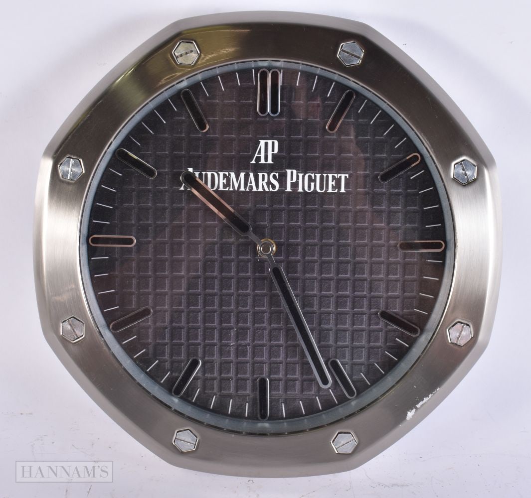 AN AUDEMARS PIGUET WALL CLOCK. 34 cm wide. (1 of 3)