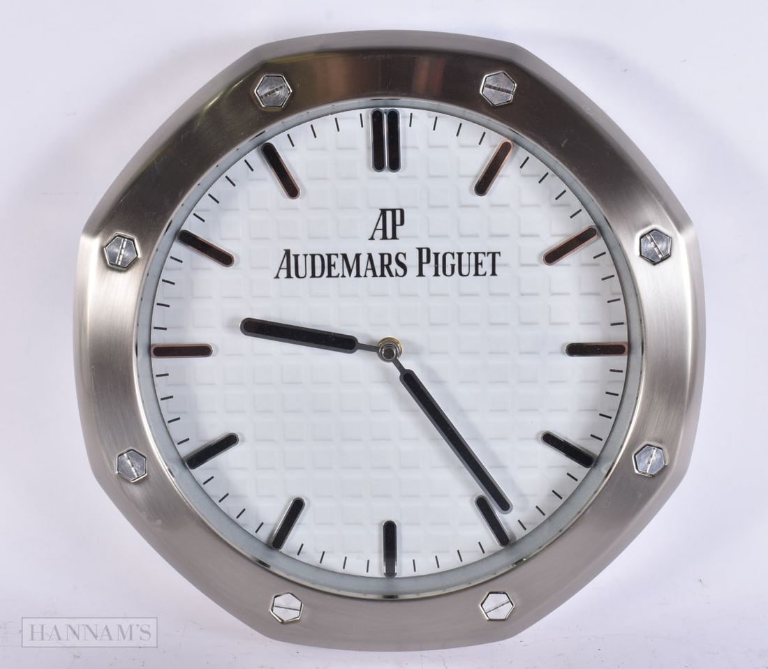AN AUDEMARS PIGUET WALL CLOCK. 34 cm wide. (1 of 3)