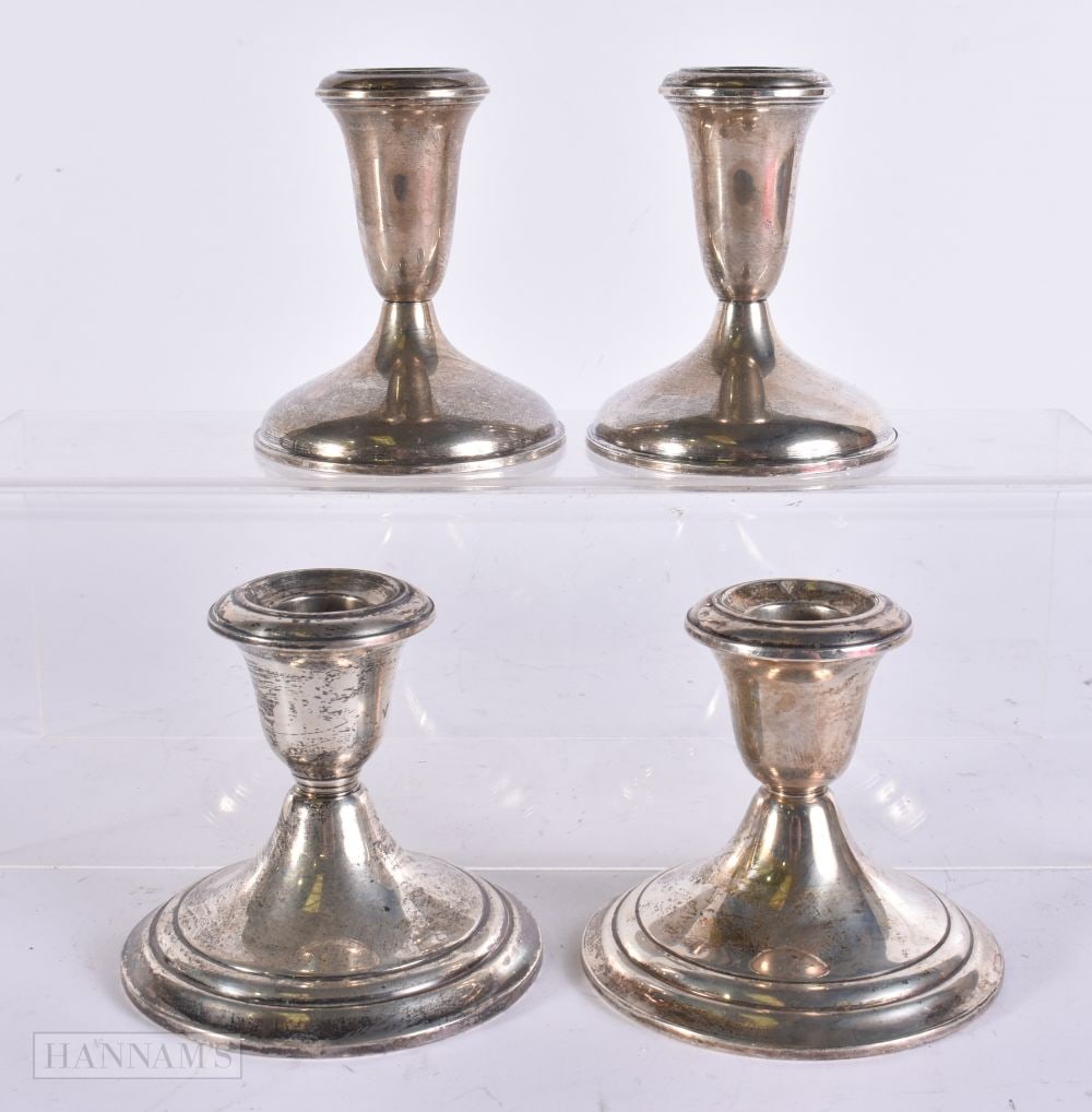 TWO PAIRS OF SILVER CANDLESTICKS. 1120 grams overall. 9 cm high. (4) (1 of 6)