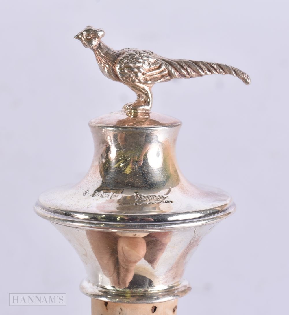 AN ASPREY'S SILVER PHEASANT BOTTLE STOPPER. 8 cm x 4.5 cm.: AN ASPREY'S SILVER PHEASANT BOTTLE STOPPER. 8 cm x 4.5 cm.