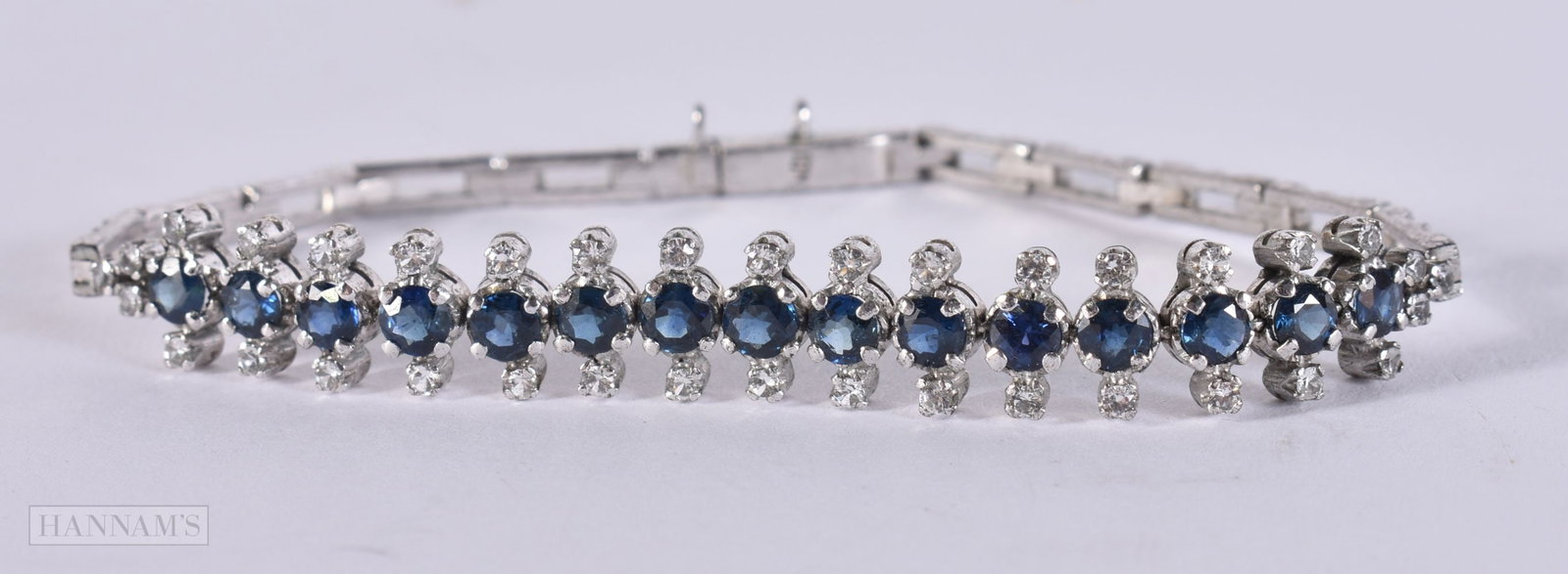 AN 18CT GOLD DIAMOND AND SAPPHIRE BRACELET. 11 grams. 18 cm long. (1 of 4)