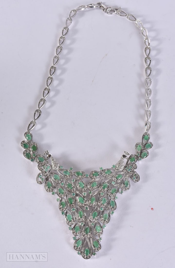 A FANCY SILVER DIAMOND AND EMERALD NECKLACE. 60.4 grams. 42 cm long.: A FANCY SILVER DIAMOND AND EMERALD NECKLACE. 60.4 grams. 42 cm long.