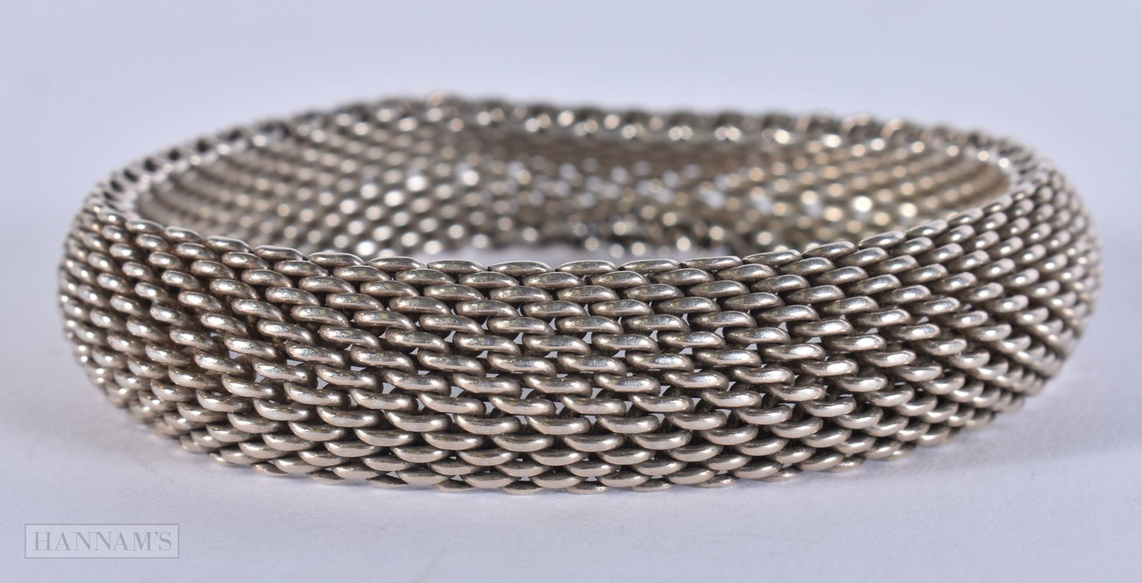 A TIFFANY & CO SILVER BRACELET. 58.3 grams. 5.75 cm internal diameter.: A TIFFANY & CO SILVER BRACELET. 58.3 grams. 5.75 cm internal diameter.