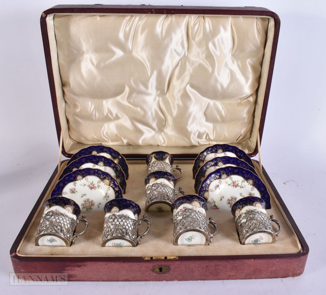 A CASED SET OF SILVER MOUNTED COALPORT CUPS AND SAUCERS. Silver 156 grams. Box 40 cm x 27 cm. (1 of 8)