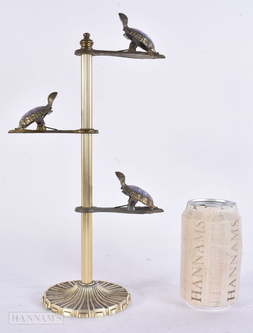 A NOVELTY ENAMELLED TORTOISE LETTER CLIP. 32 cm high. (1 of 5)