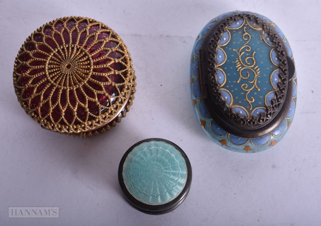 AN ART DECO SILVER AND ENAMEL BOX together with two glass pill boxes. Largest 5 cm wide. (3) (1 of 3)