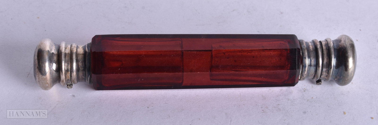 A VICTORIAN SILVER RUBY GLASS DOUBLE ENDED SCENT BOTTLE. 45.2 grams. 13 cm long.: A VICTORIAN SILVER RUBY GLASS DOUBLE ENDED SCENT BOTTLE. 45.2 grams. 13 cm long.