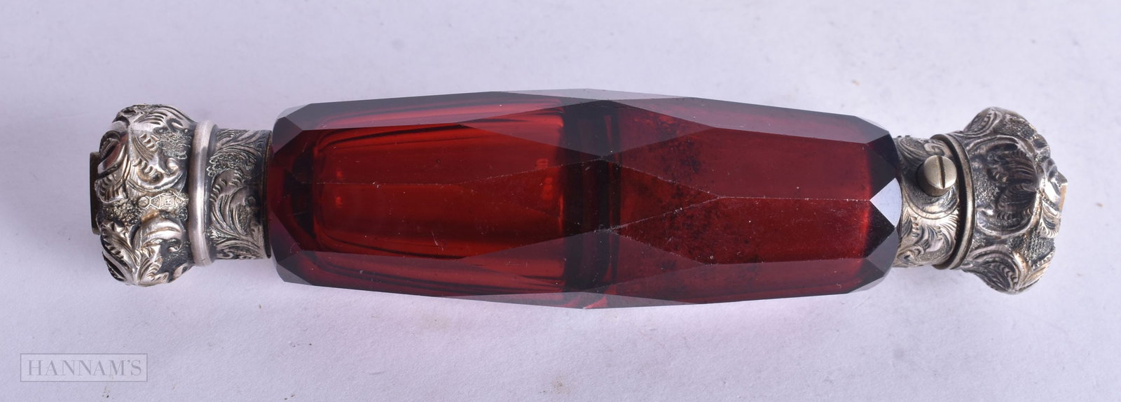 A VICTORIAN SILVER RUBY GLASS DOUBLE ENDED SCENT BOTTLE. 71.3 grams. 13.75 cm long.: A VICTORIAN SILVER RUBY GLASS DOUBLE ENDED SCENT BOTTLE. 71.3 grams. 13.75 cm long.