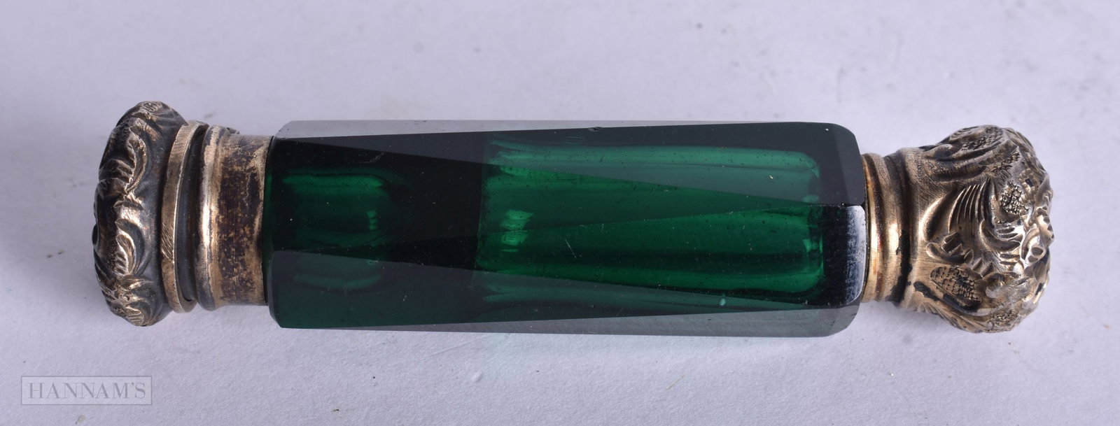 A VICTORIAN SILVER GILT GREEN GLASS SCENT BOTTLE. 32 grams. 7.75 cm long. (1 of 3)